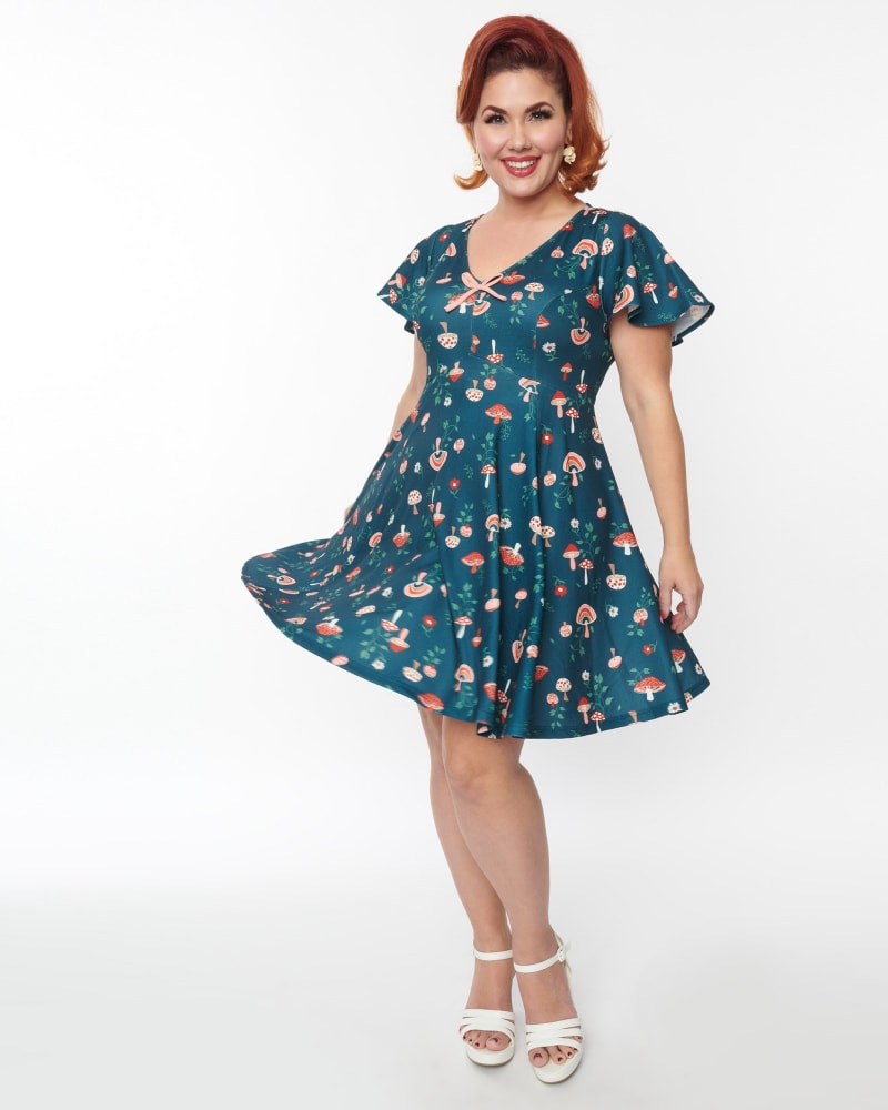 Front of a model wearing a size 5X Unique Vintage Curve Green Mushroom Print Fit & Flare Flutter Dress in Green by Unique Vintage. | dia_product_style_image_id:287087